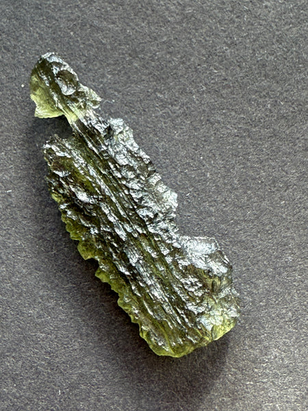 Genuine raw 2.20 grams moldavite from Czech Republic.