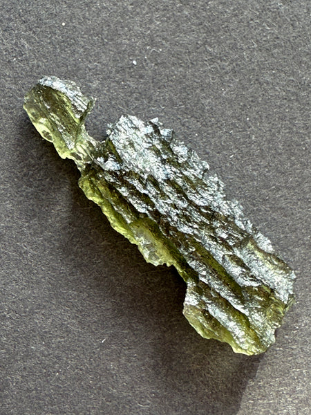 Genuine raw 2.20 grams moldavite from Czech Republic.