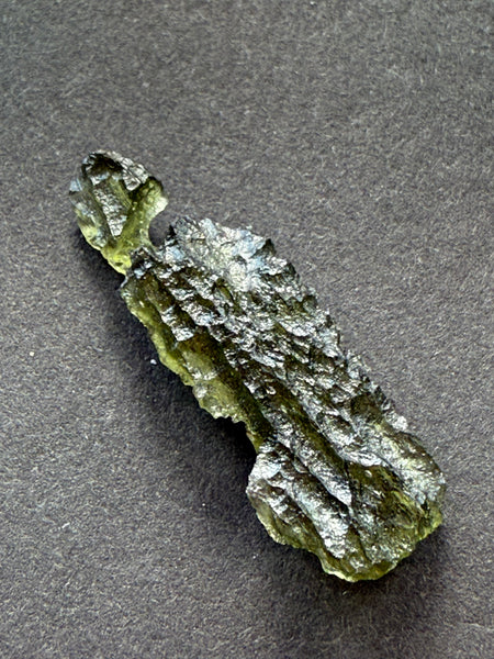 Genuine raw 2.20 grams moldavite from Czech Republic.