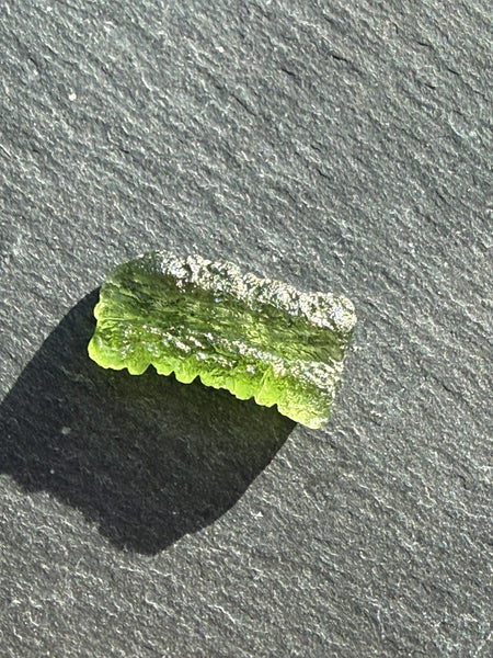 Genuine 1.4 grams Moldavite from Czech Republic.