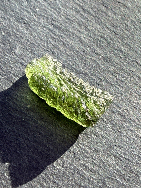 Genuine 1.4 grams Moldavite from Czech Republic.