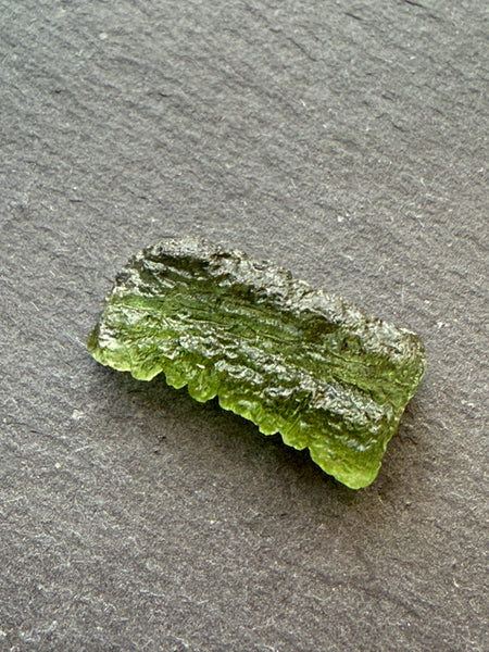 Genuine 1.4 grams Moldavite from Czech Republic.