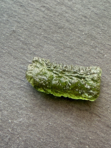 Genuine 1.4 grams Moldavite from Czech Republic.