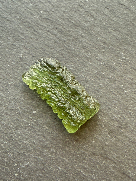 Genuine 1.4 grams Moldavite from Czech Republic.